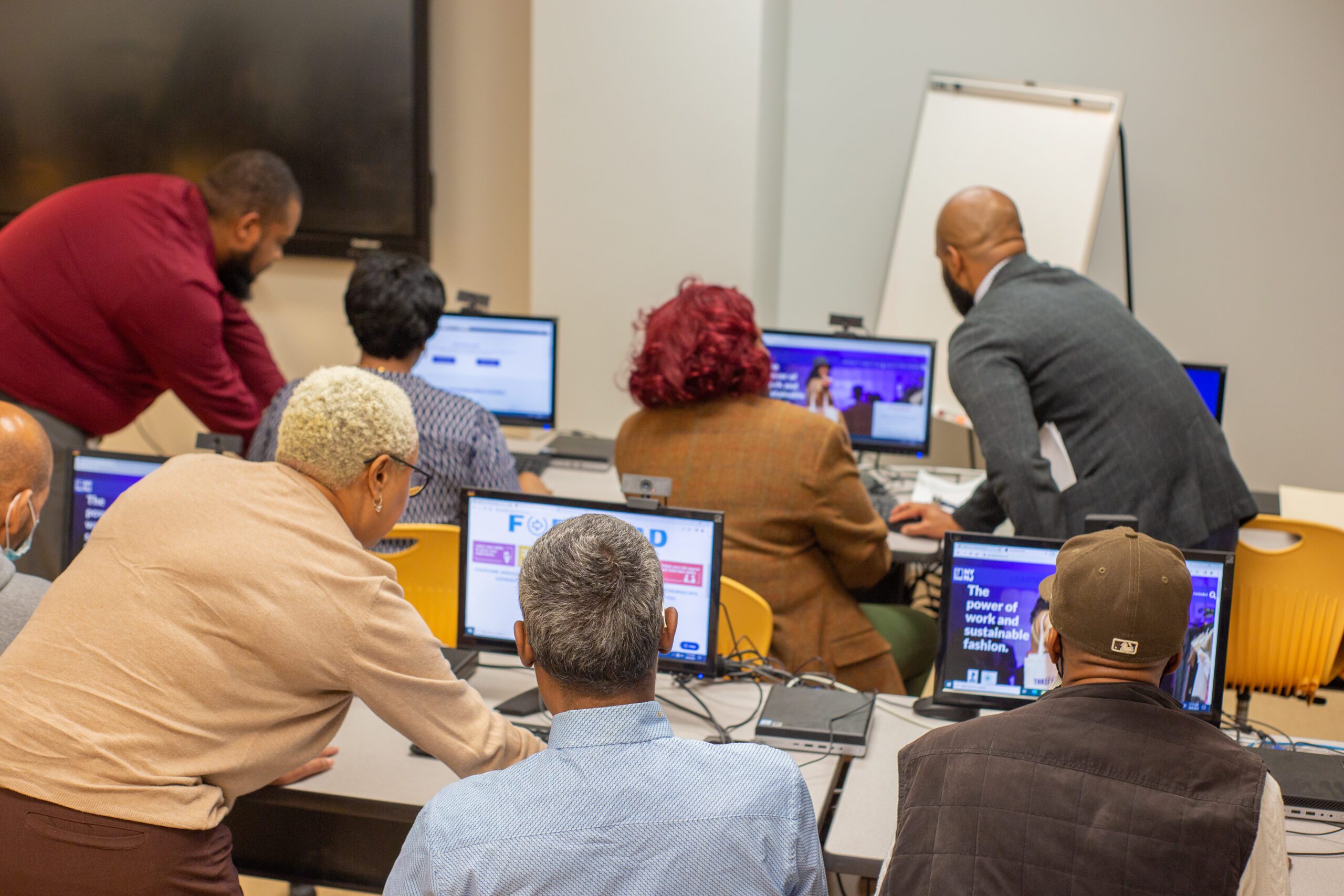 bridge to tech participants working with computers