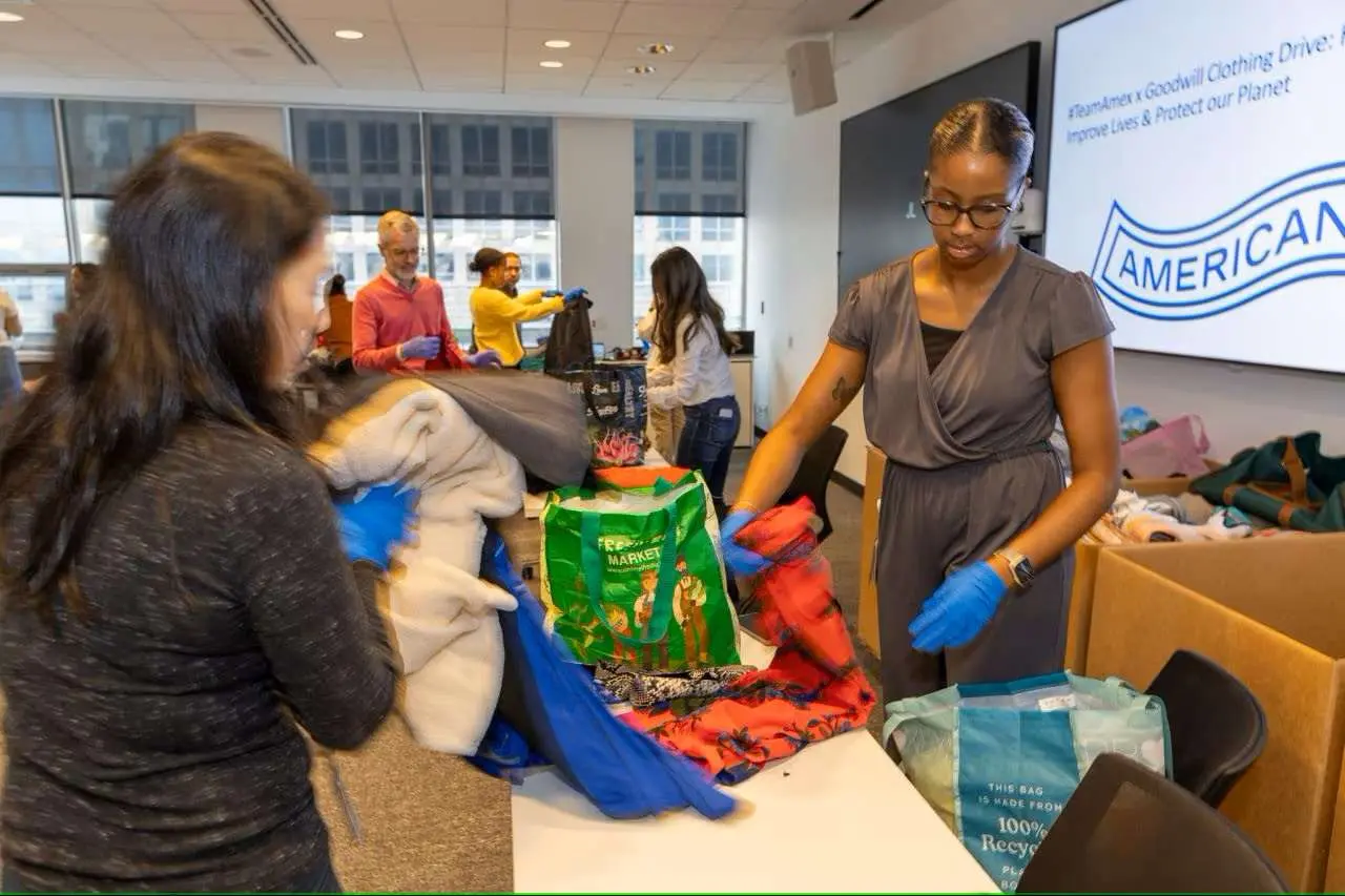 Volunteers prepare bags filled with supplies, showcasing their dedication and teamwork.